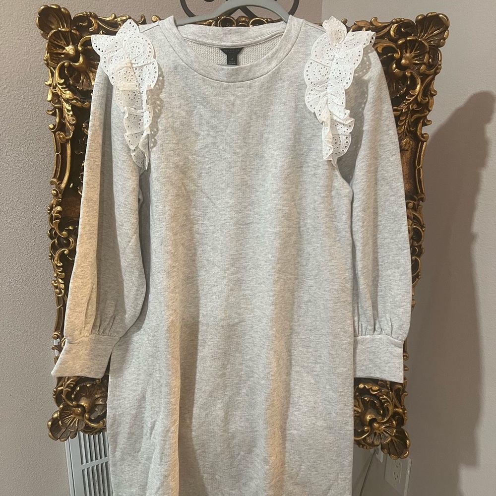 Gorgeous sweater dress with eyelets trim on the front
